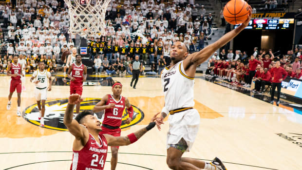 Jan 31, 2024; Columbia, Missouri, USA; Missouri Tigers guard Tamar Bates (2) shoots against Arkansas Razorbacks guard Jeremiah Davenport (24) during the second half at Mizzou Arena. 